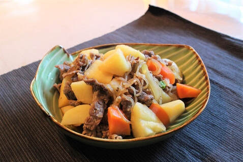Bowl of thin beef, thin noodles, potatoes, and carrots