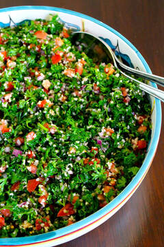 Tabbouleh- green mixture with pieced tomato and cucumber.